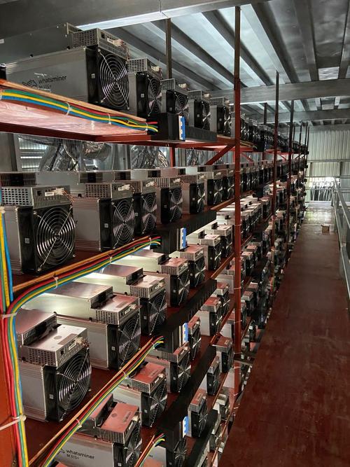 A large-scale cryptocurrency mining farm with rows of racks full of miners