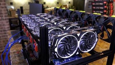 A photo showing a mining farm filled with rows of mining rigs.